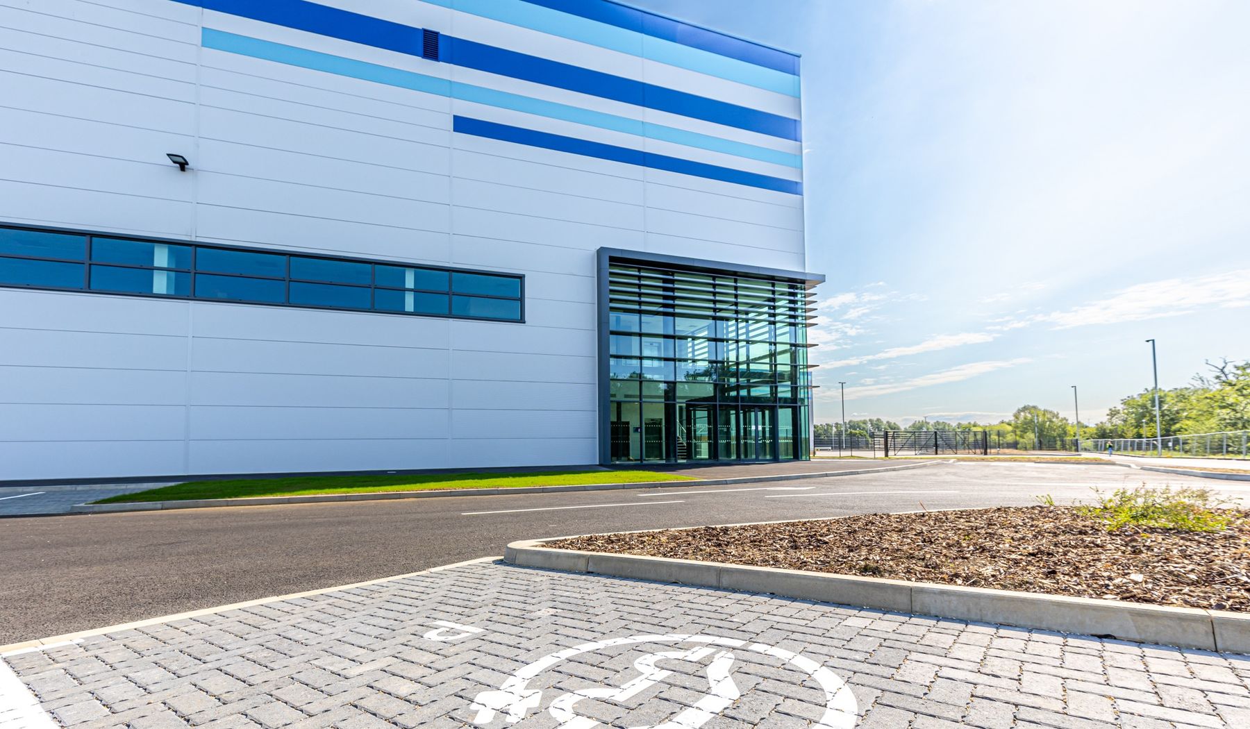 Office entrance and EV charging bays